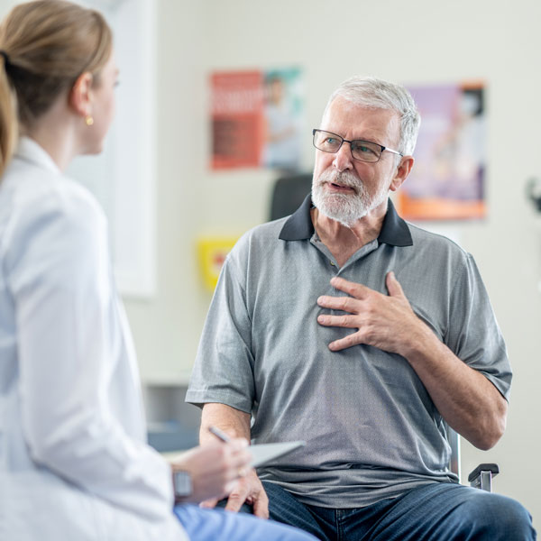 doctor meeting with senior male patient